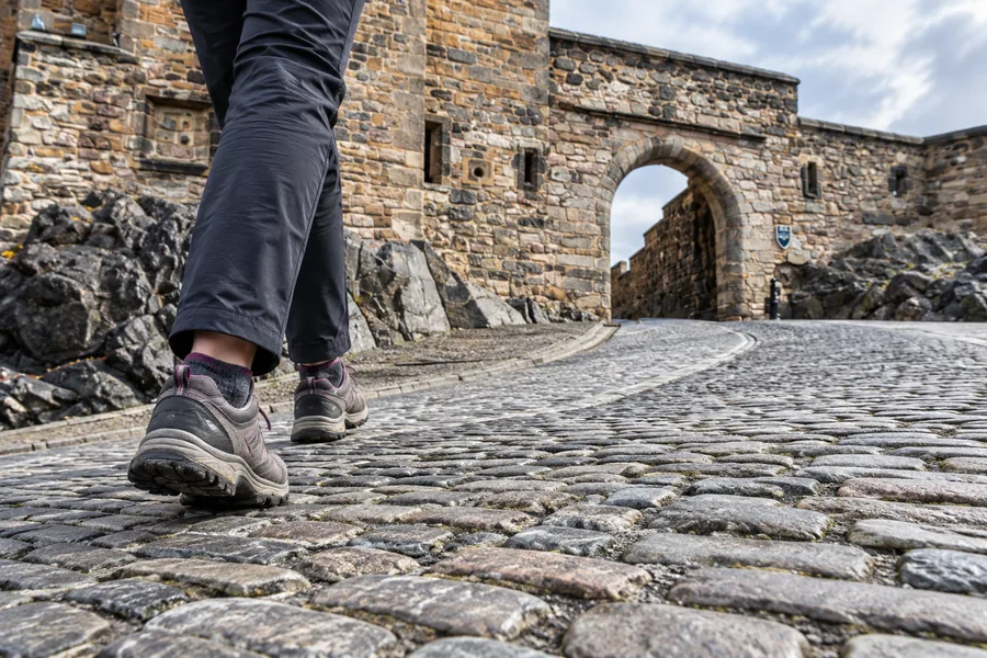 Comfortable walking shoes on the cobbled slope leading to Foog’s Gate